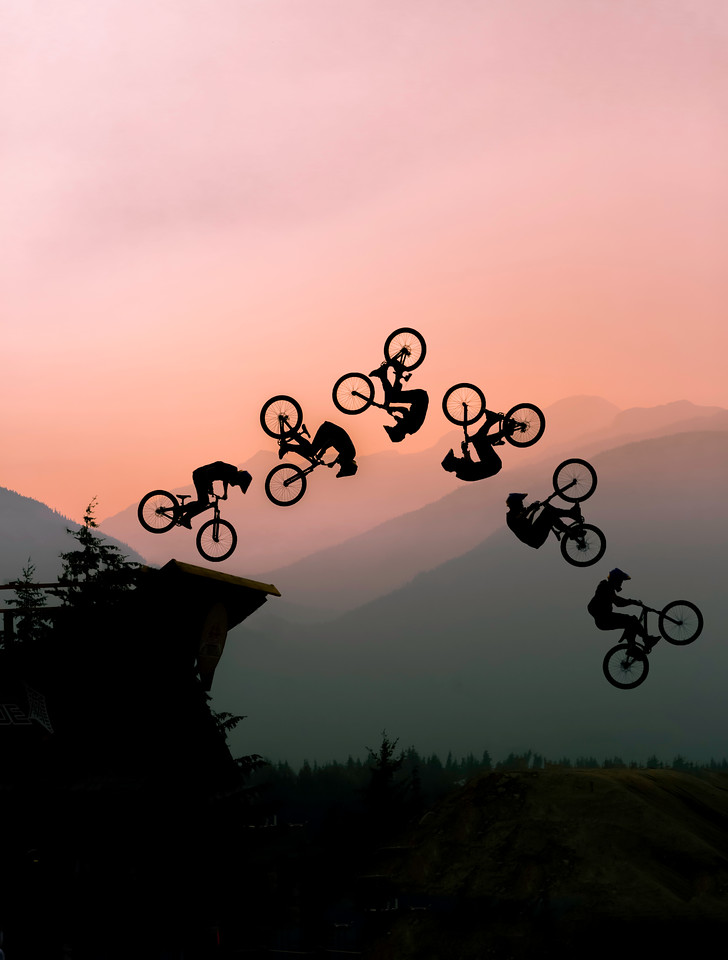 Composite sequence of mountain biker performing backflip at golden hour
