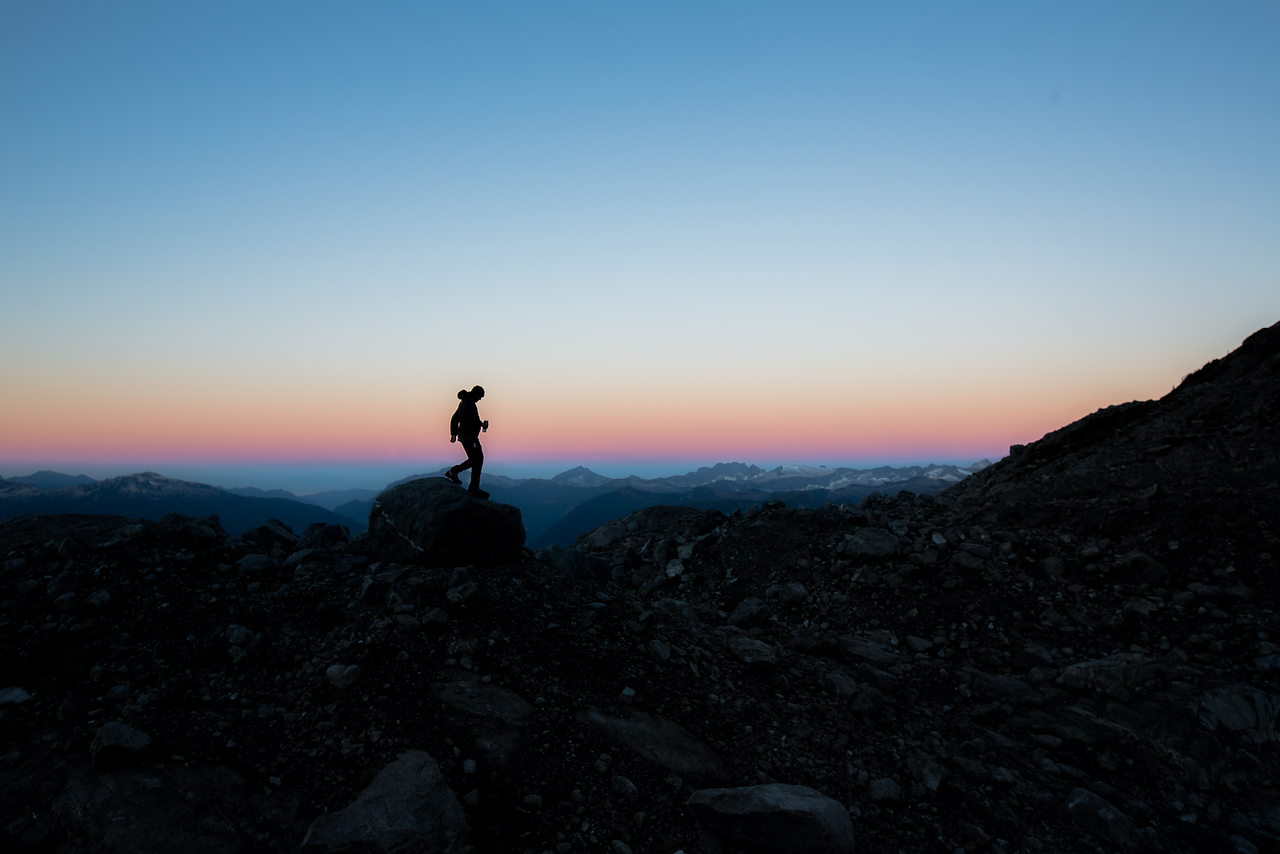 Silhouette of the Tantalus Range against a vibrant sunrise sky